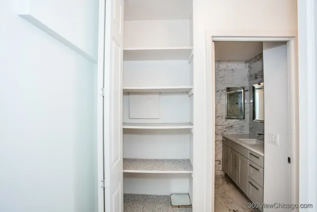 a bathroom with a sink and mirror