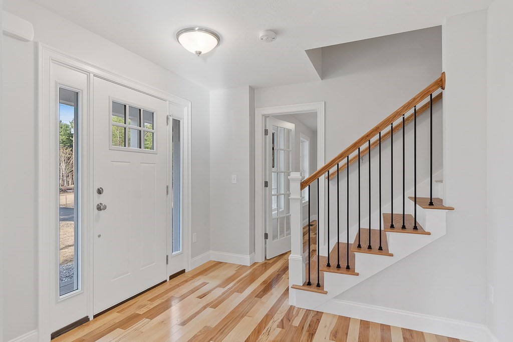 207 Worcester Road Princeton, MA 01541 - Photo 3 of 26 a view of a hallway with wooden floor and staircase
