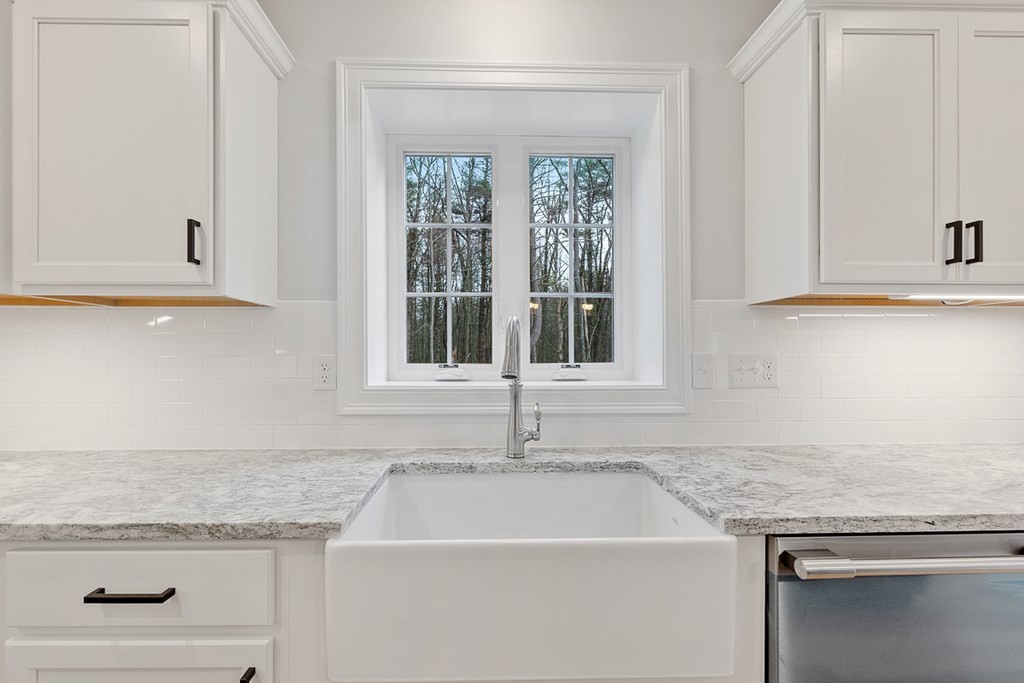 207 Worcester Road Princeton, MA 01541 - Photo 8 of 26 a kitchen with granite countertop white cabinets and a sink