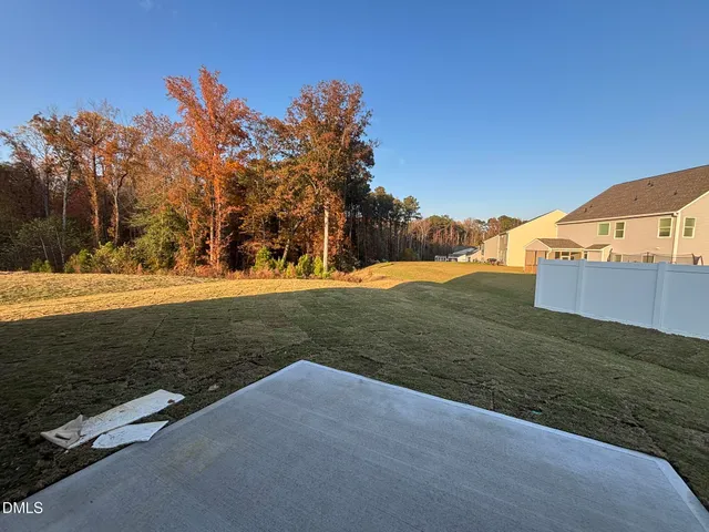 a view of a field with an trees