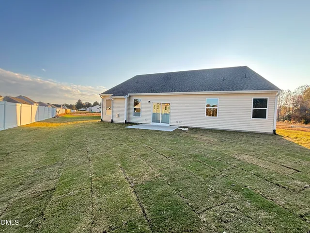 a house view with swimming pool in front of it