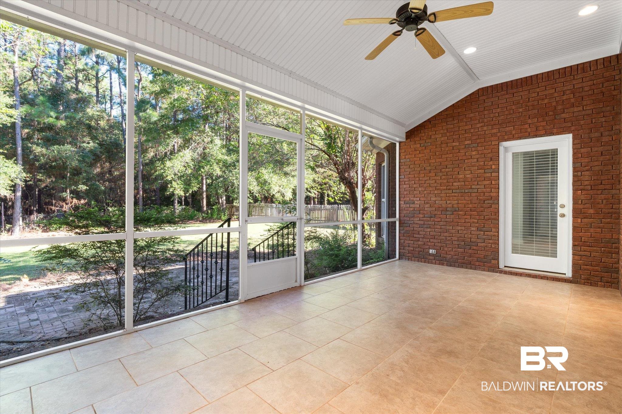 10730 Flagstone Drive Mobile, AL 36608 - Photo 19 of 20 Unfurnished sunroom featuring vaulted ceiling, ceiling fan, wooden ceiling, and plenty of natural light