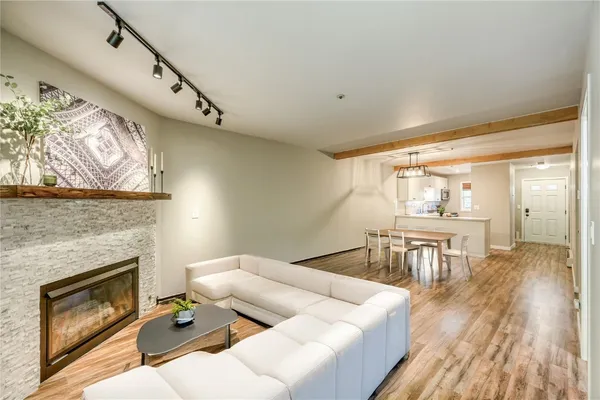 a living room with furniture and a fireplace