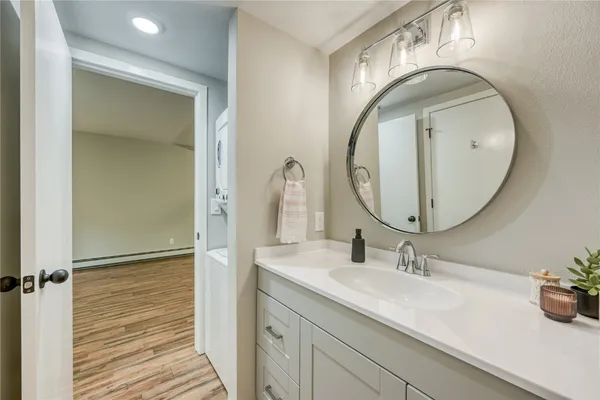 a bathroom with a sink and a mirror