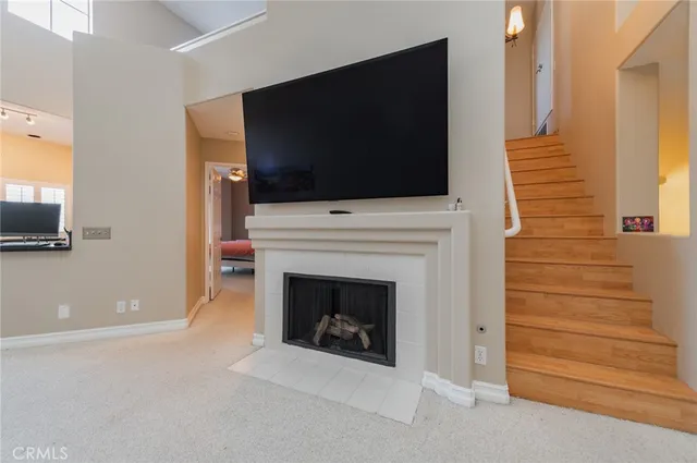 a living room with furniture and a toilet