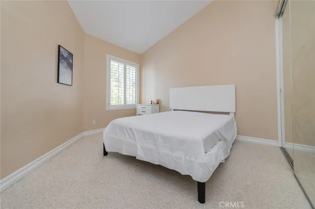 a room with a bed and window