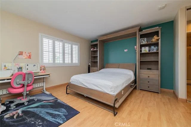 a bedroom with a bed and closet