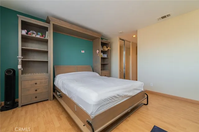 a bathroom with a bathtub shower sink vanity mirror and toilet