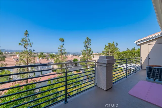 a view of a chairs and table in front of house