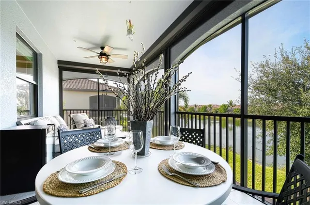 a room with furniture and a large window