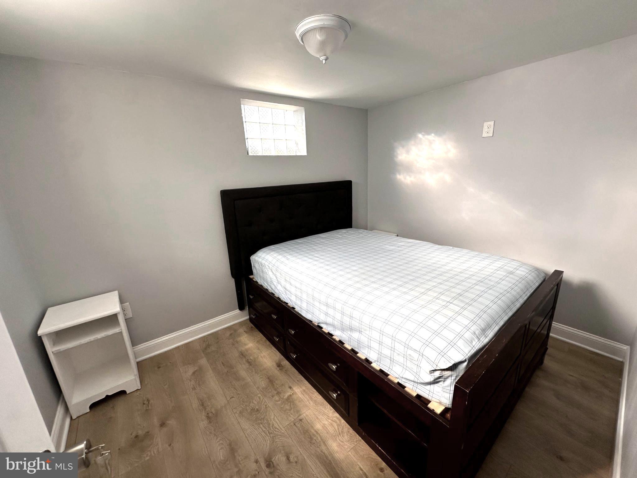 1008 Tunbridge Road Baltimore, MD 21212 - Photo 7 of 19 a bedroom with a bed and a window