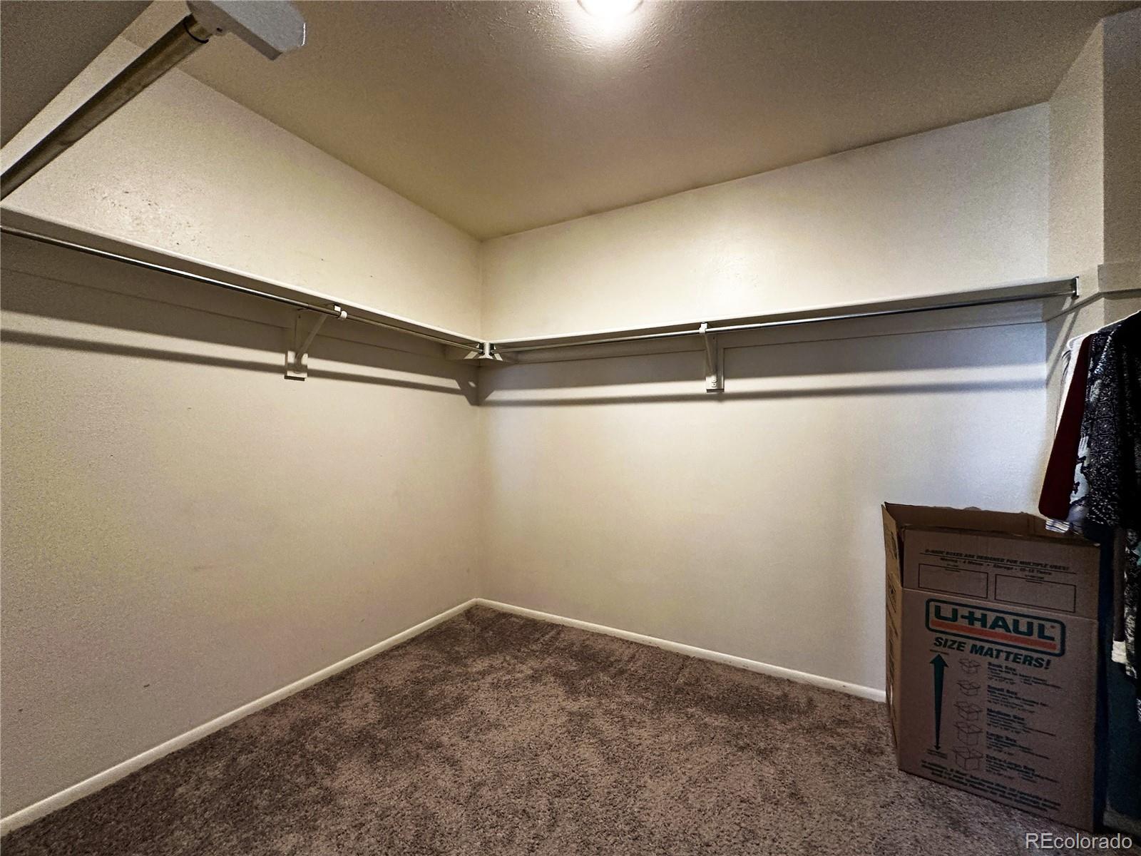 10753 Routt Court Broomfield, CO 80021 - Photo 12 of 24 a view of a room with racks on the wall