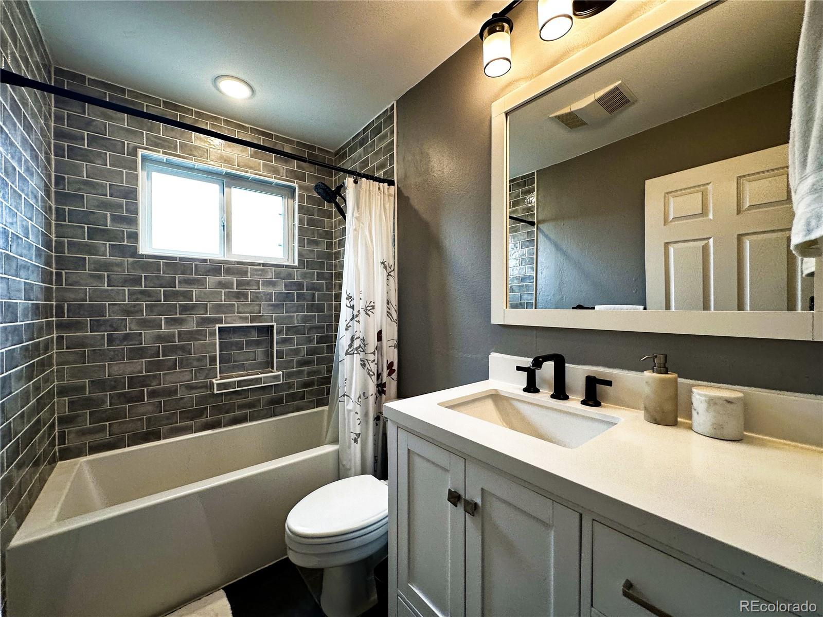 10753 Routt Court Broomfield, CO 80021 - Photo 13 of 24 a bathroom with a sink and a bathtub