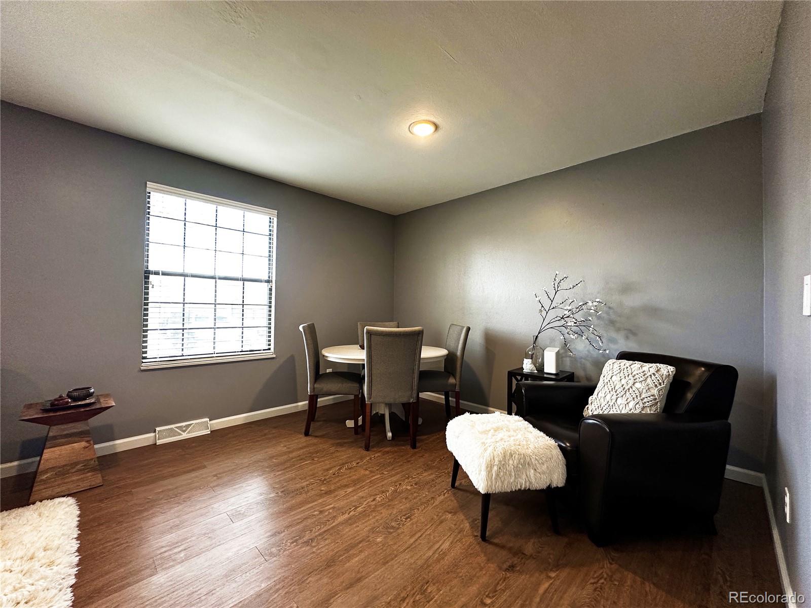 10753 Routt Court Broomfield, CO 80021 - Photo 4 of 24 a living room with furniture and wooden floor