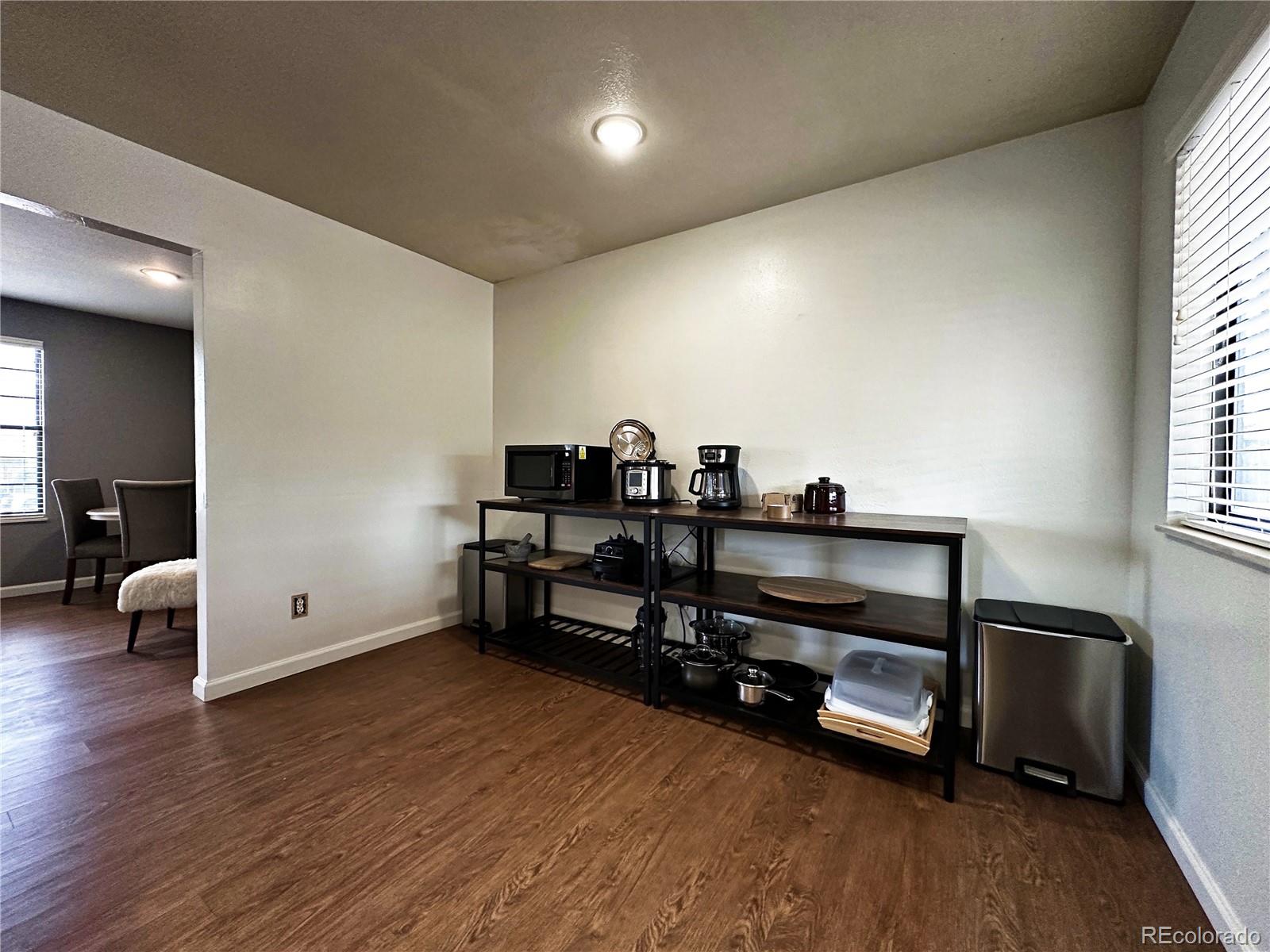 10753 Routt Court Broomfield, CO 80021 - Photo 5 of 24 a view of a room with chairs and wooden floor