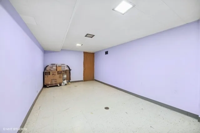 a view of a room with air conditioner and a window