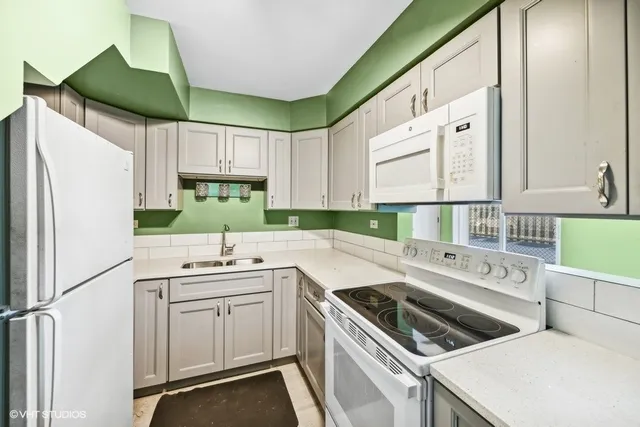 a kitchen that has a cabinets and a stove