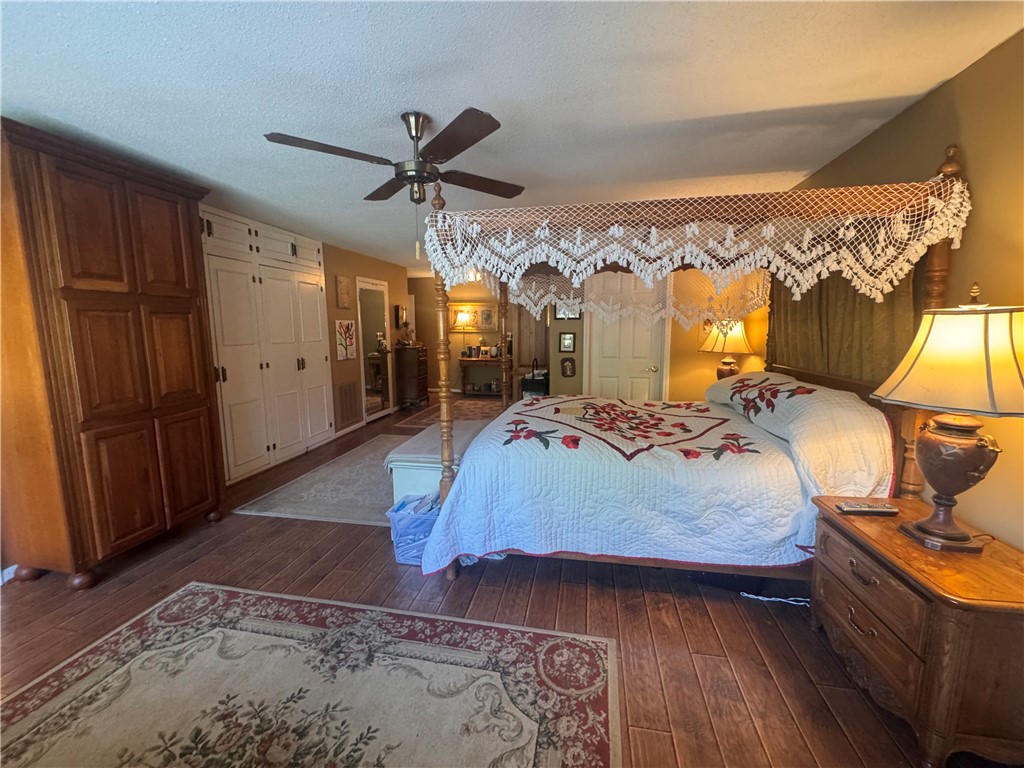 208 Knoxwood Court Anderson, SC 29621 - Photo 18 of 38 This spacious primary bedroom features rich wood flooring and ample storage solutions.