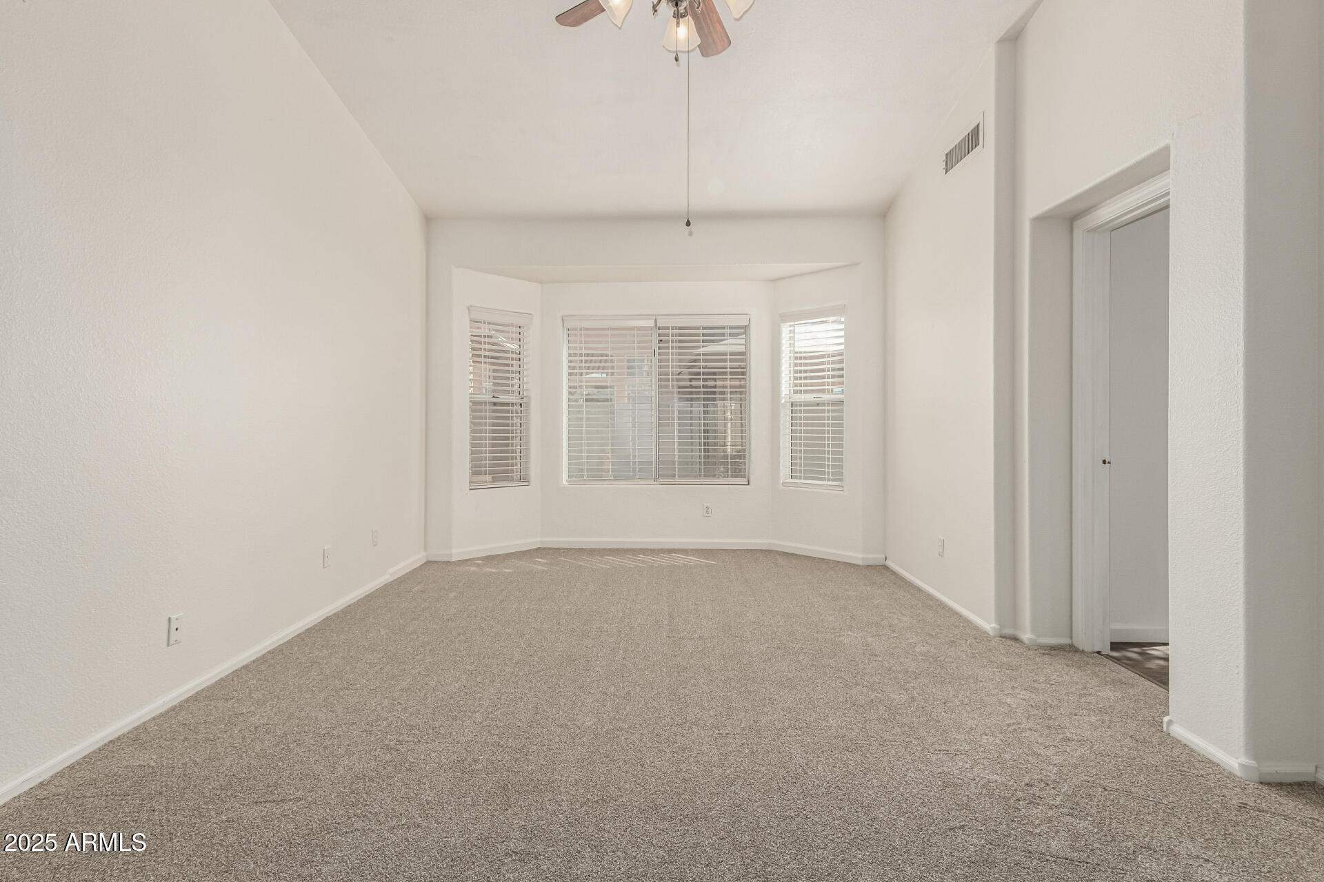 217 West Smoke Tree Road Gilbert, AZ 85233 - Photo 12 of 48 wooden floor in an empty room with a window
