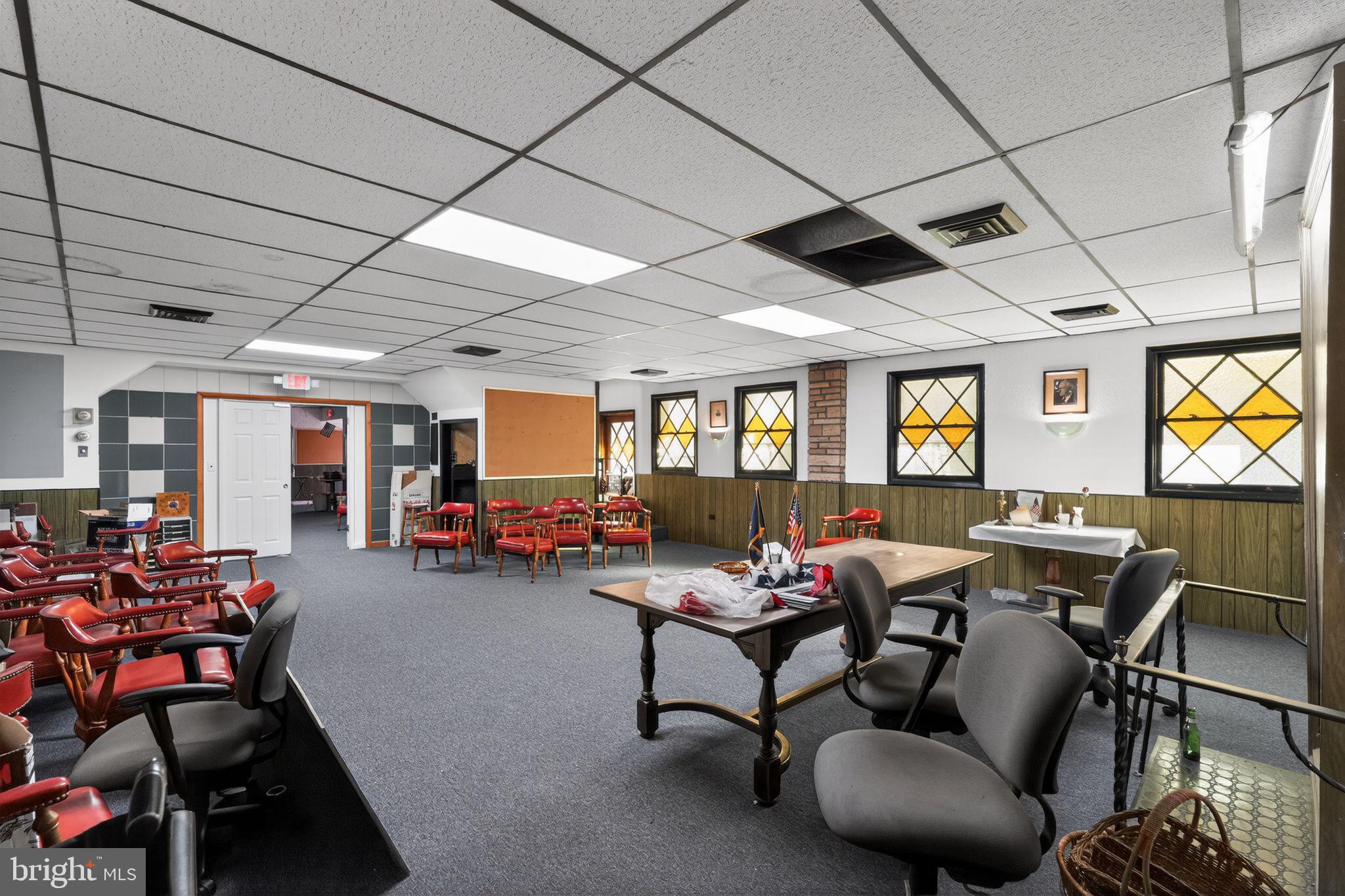 6600 Ridge Avenue Philadelphia, PA 19128 - Photo 15 of 47 a living room with furniture a flat screen tv and a large window