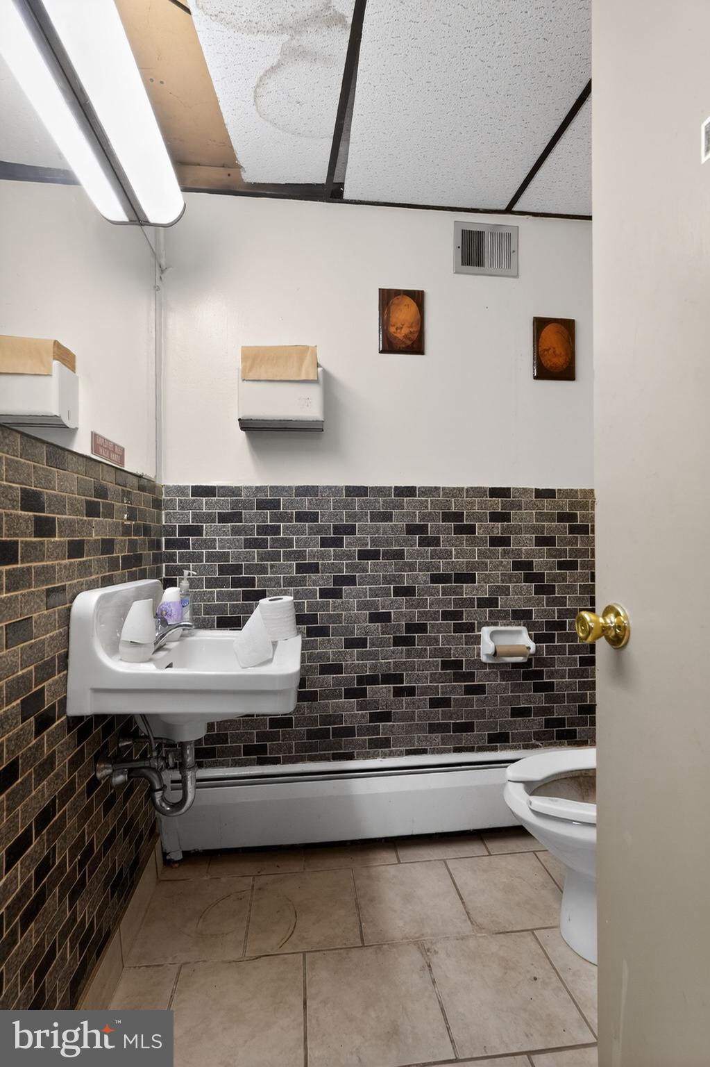 6600 Ridge Avenue Philadelphia, PA 19128 - Photo 21 of 47 a bathroom with a sink a mirror and a shower