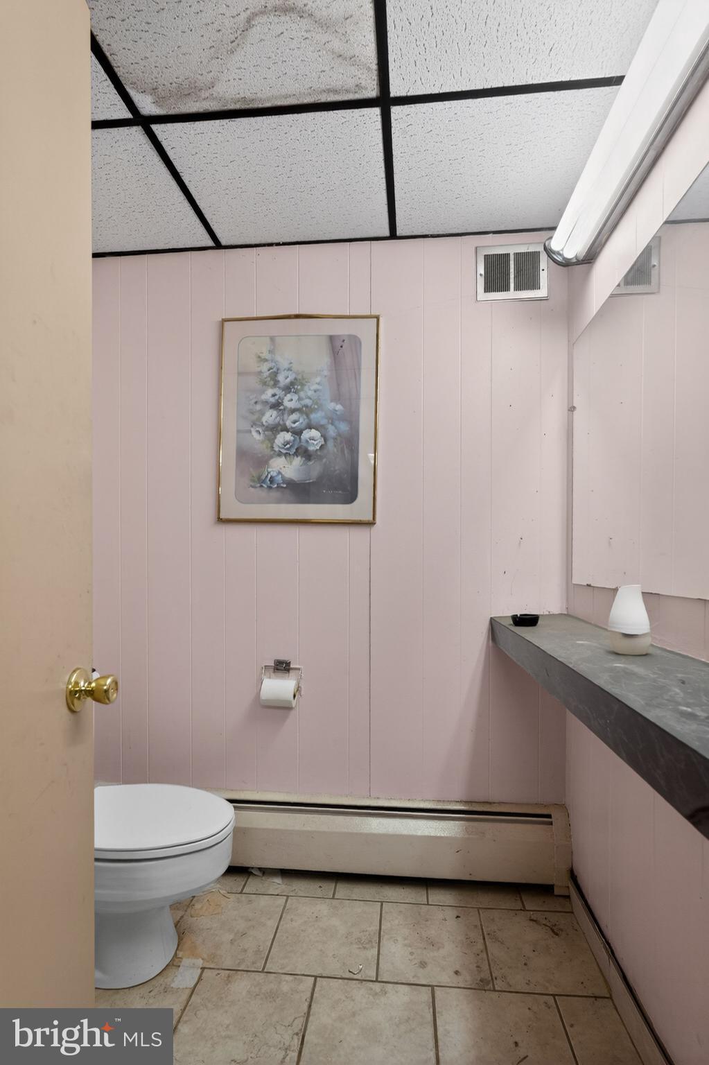 6600 Ridge Avenue Philadelphia, PA 19128 - Photo 22 of 47 a bathroom with a granite countertop sink a toilet and a mirror