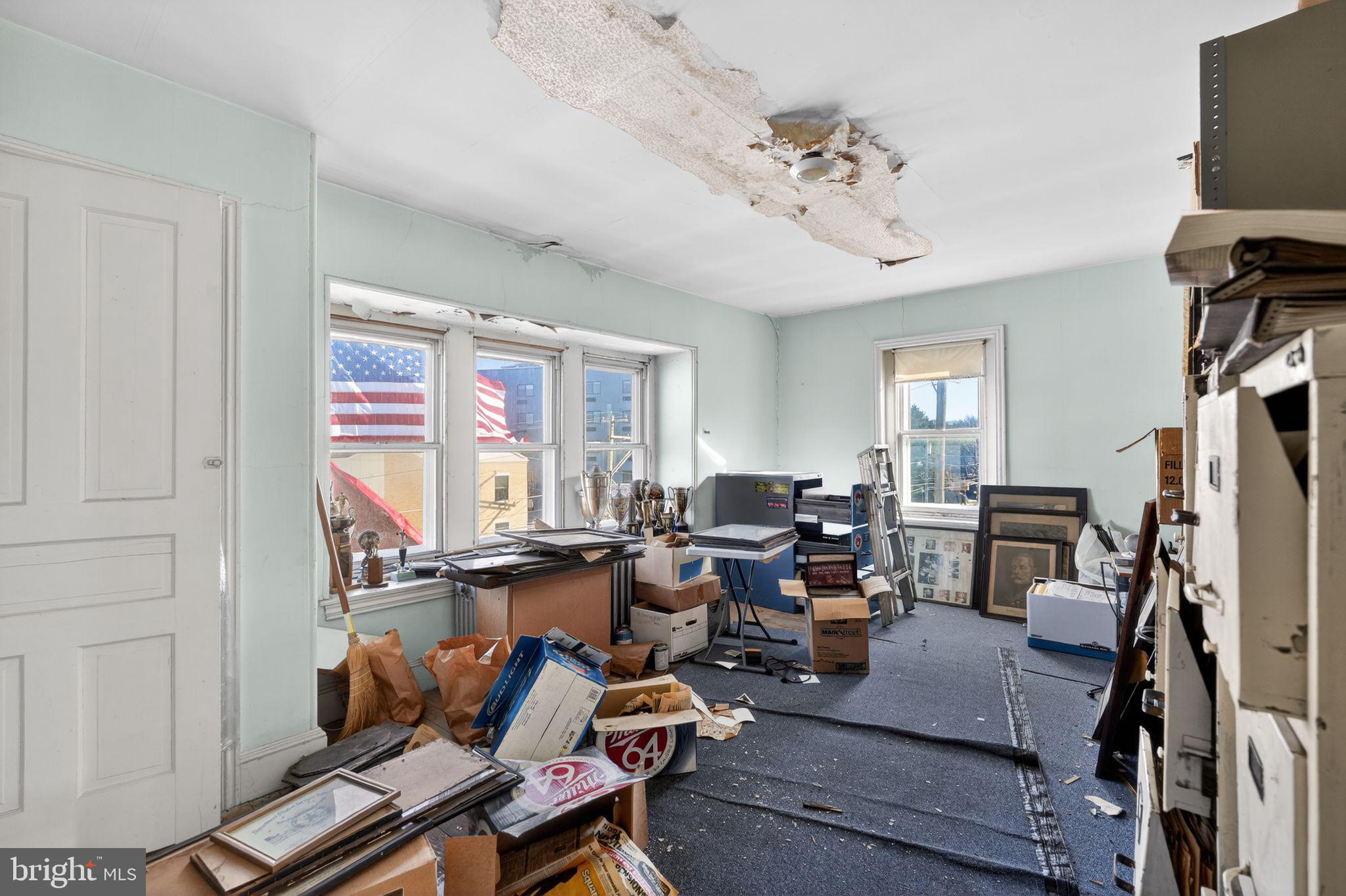 6600 Ridge Avenue Philadelphia, PA 19128 - Photo 35 of 47 a living room with furniture and a flat screen tv