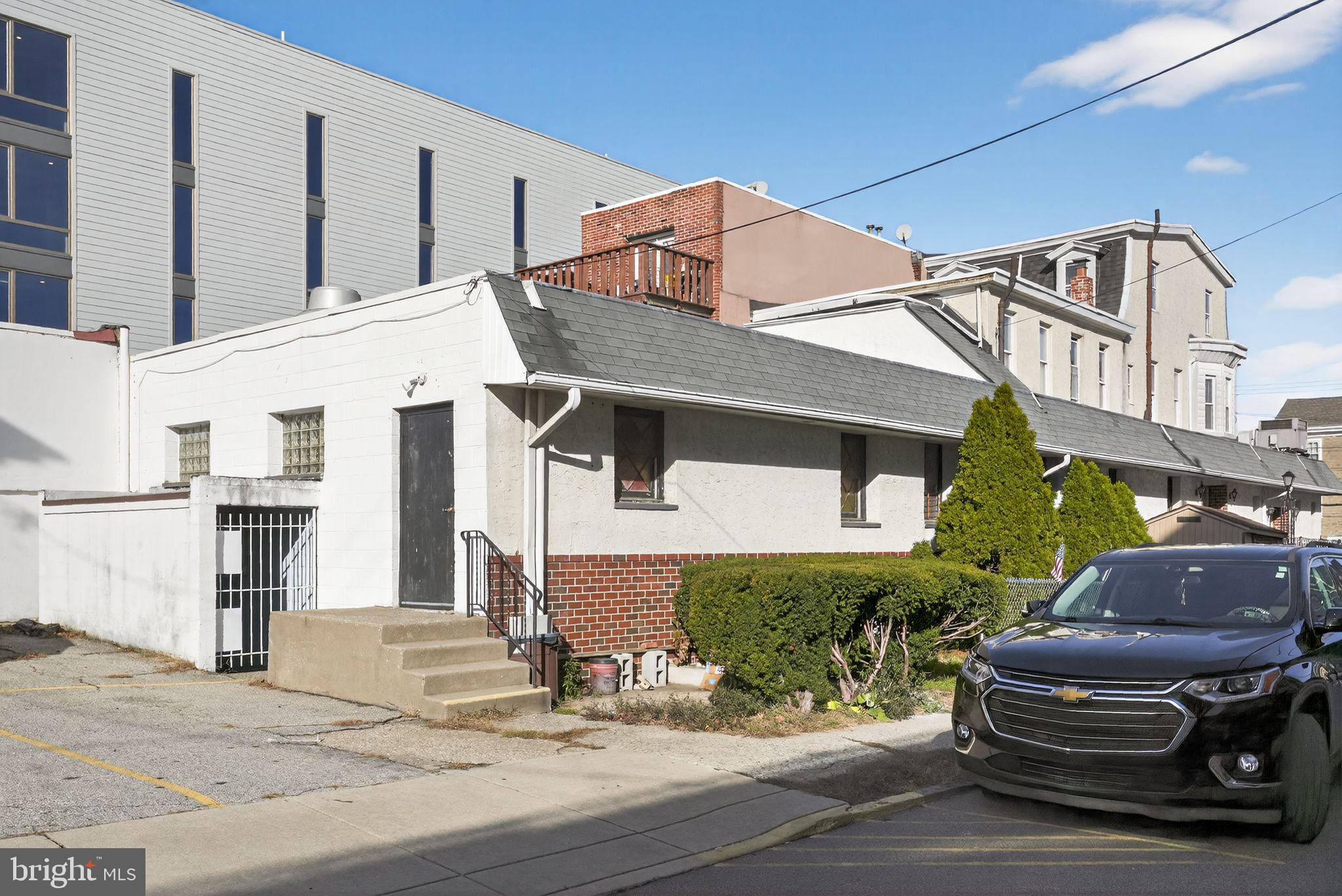 6600 Ridge Avenue Philadelphia, PA 19128 - Photo 4 of 47 a front view of a house with garden