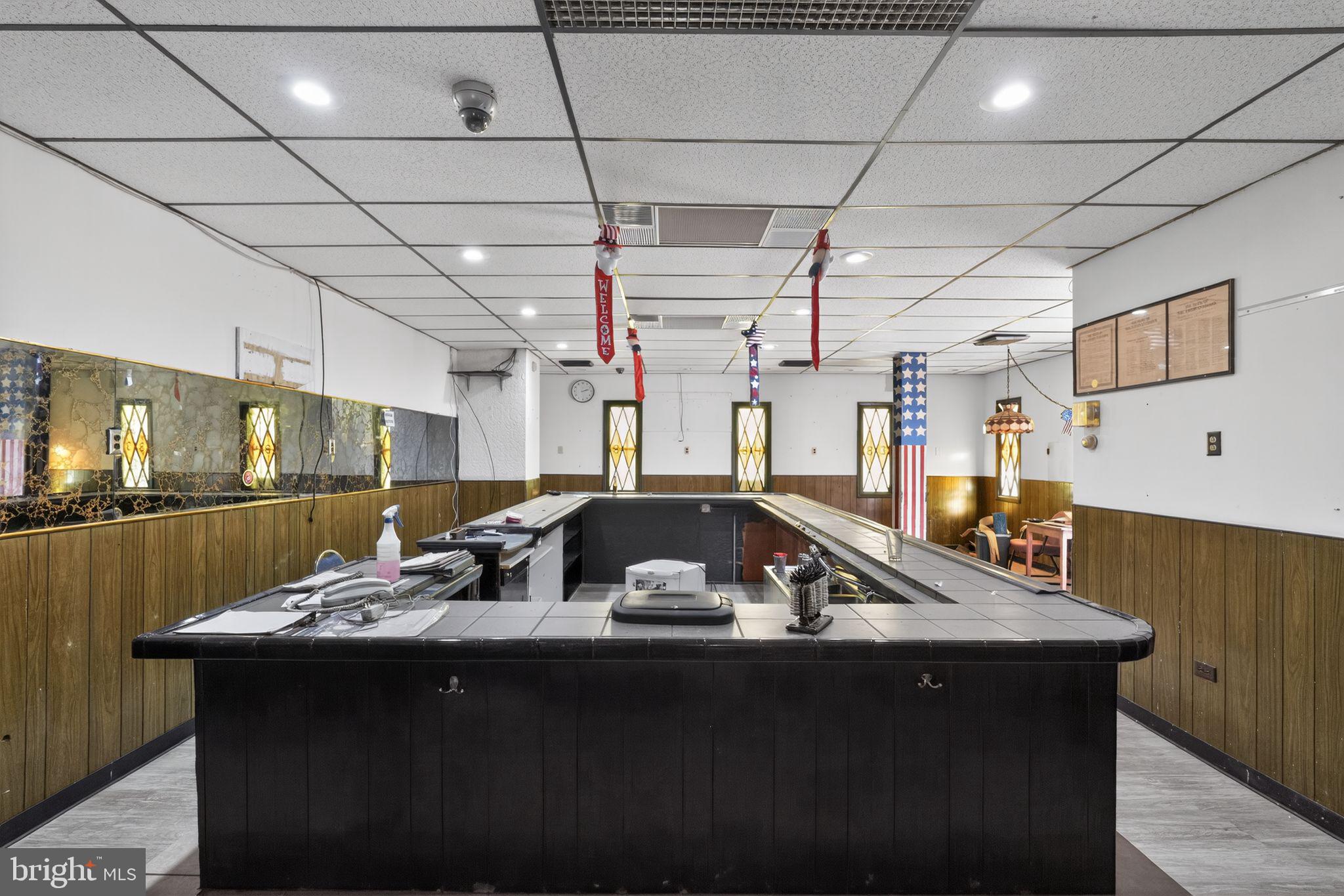 6600 Ridge Avenue Philadelphia, PA 19128 - Photo 8 of 47 a kitchen with a sink a counter and chairs