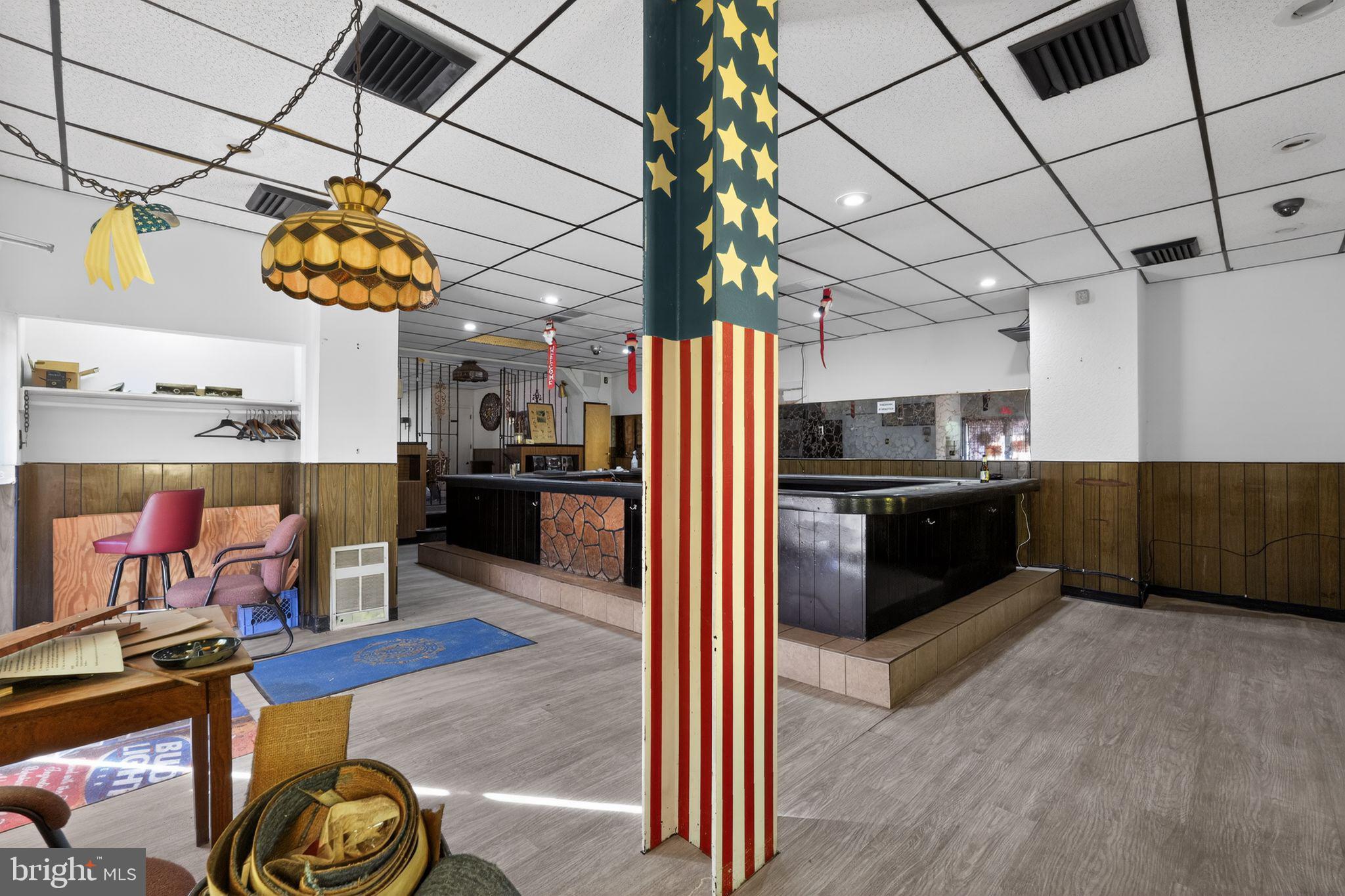 6600 Ridge Avenue Philadelphia, PA 19128 - Photo 10 of 47 a kitchen with stainless steel appliances kitchen island granite countertop a refrigerator and a stove