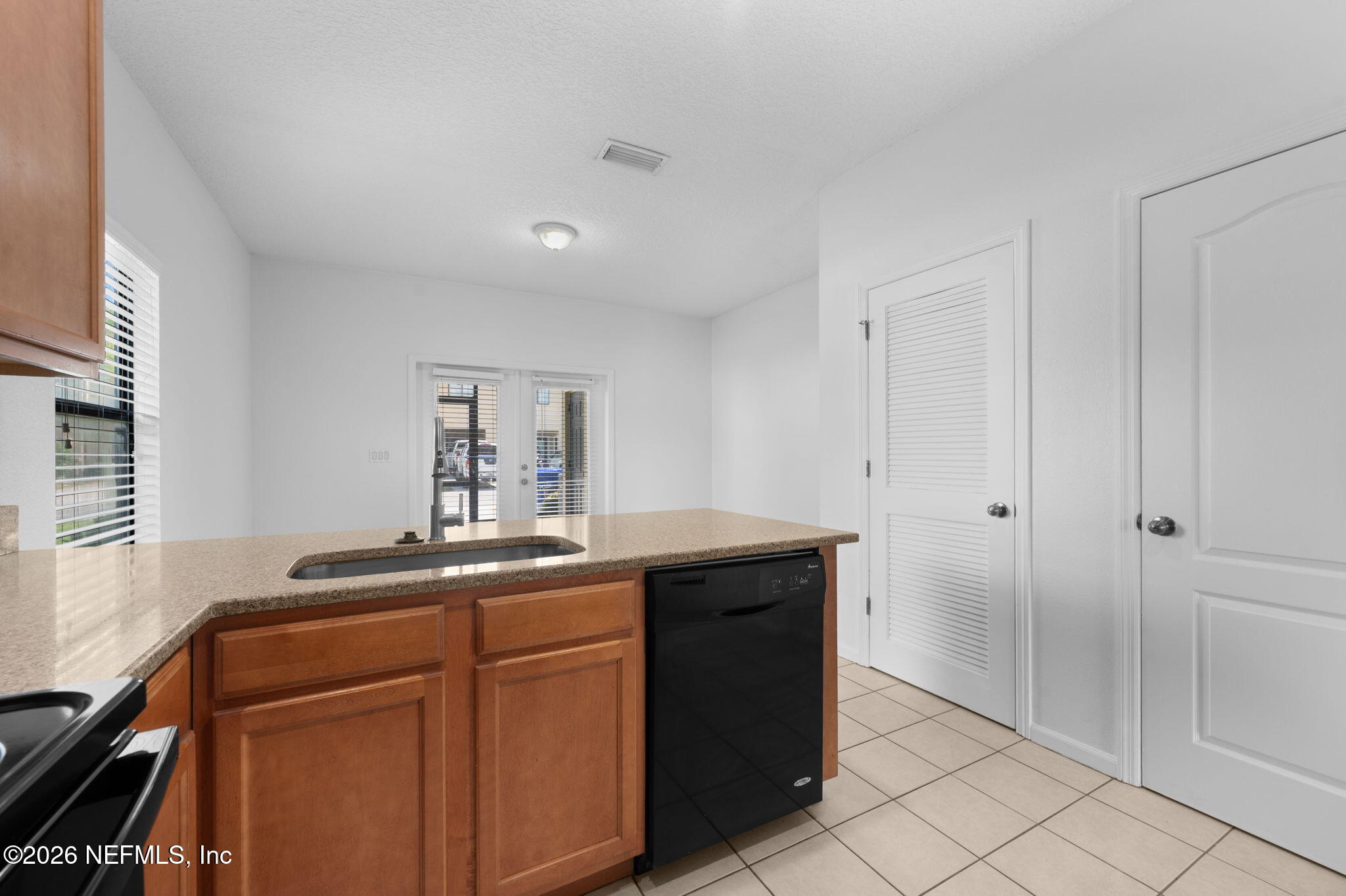 253 Syrah Way St. Augustine, FL 32084 - Photo 11 of 39 a kitchen with a sink and cabinets