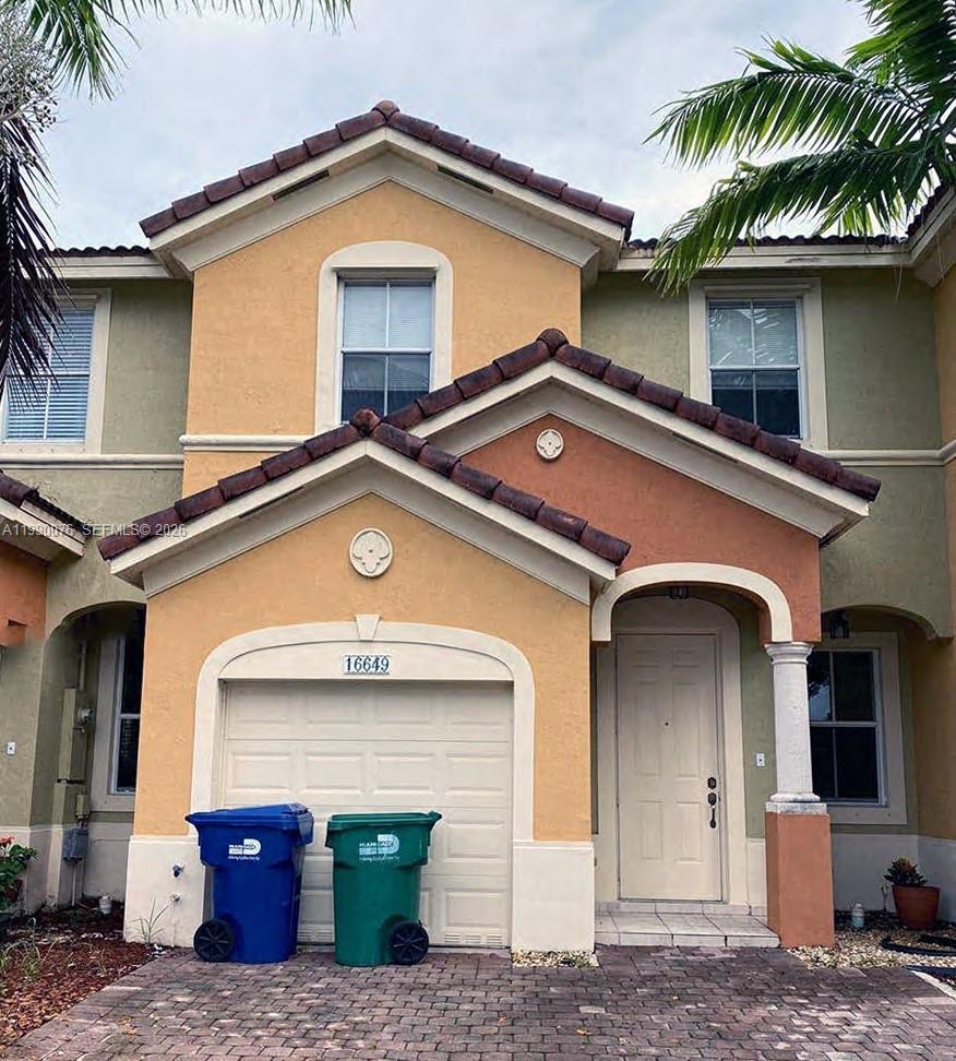 16649 Southwest 80th Terrace Miami, FL 33193 - Photo 1 of 1 a front view of a house with garden
