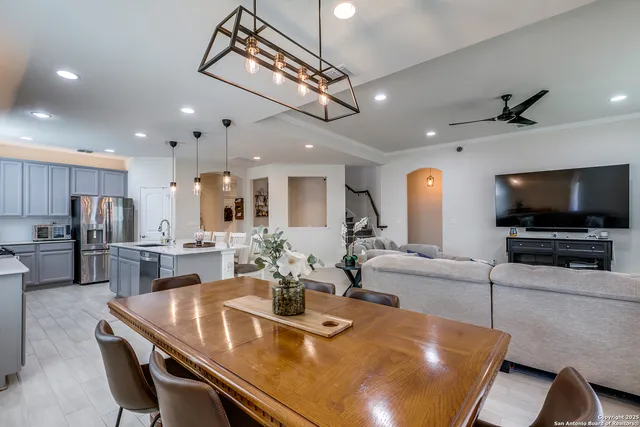 a kitchen with stainless steel appliances kitchen island granite countertop a sink and cabinets