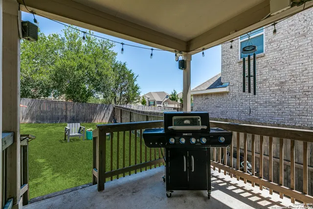 a view of a chairs and table in the balcony
