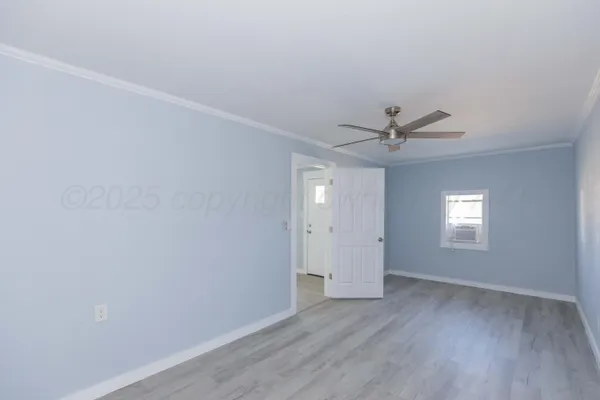 a view of an empty room with a window