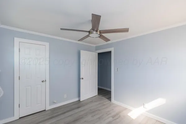 a view of a livingroom with a chandelier fan