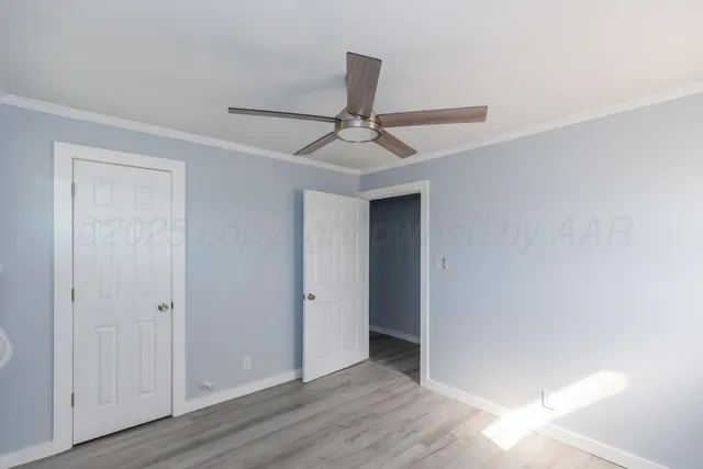 a view of a livingroom with a chandelier fan