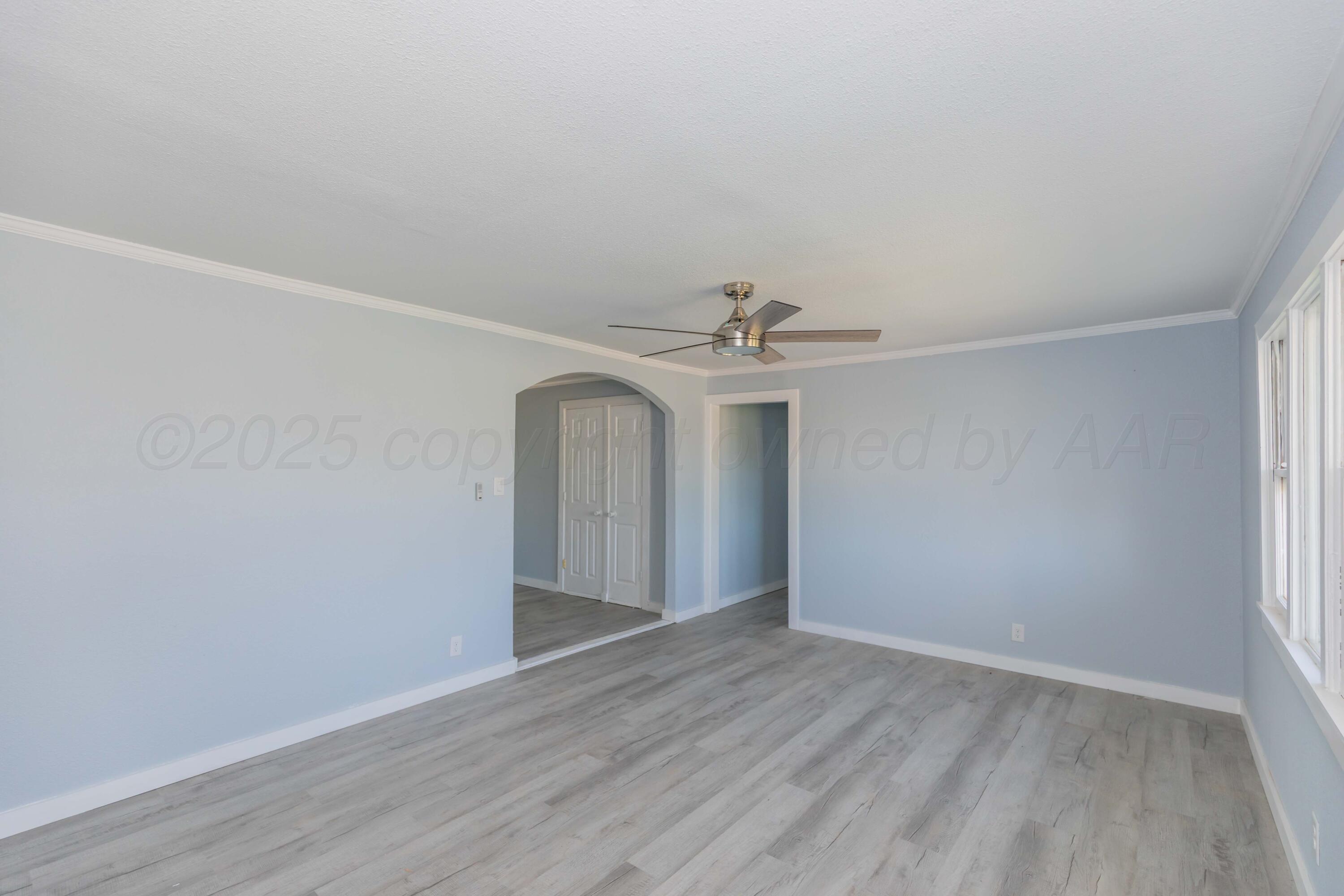 1100 North Missouri Street Shamrock, TX 79079 - Photo 6 of 39 a view of an empty room with wooden floor