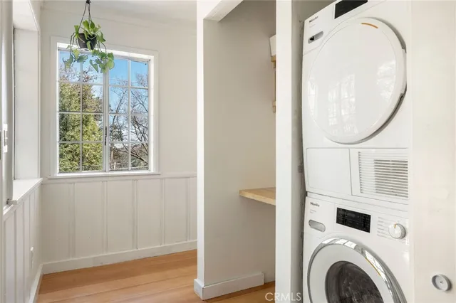 a view of a hallway with washer and dryer