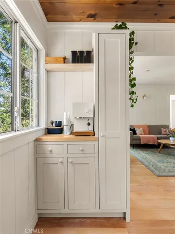 a kitchen with a refrigerator and a sink
