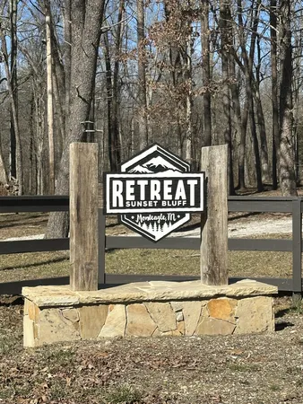 a view of a wooden fence next to a road