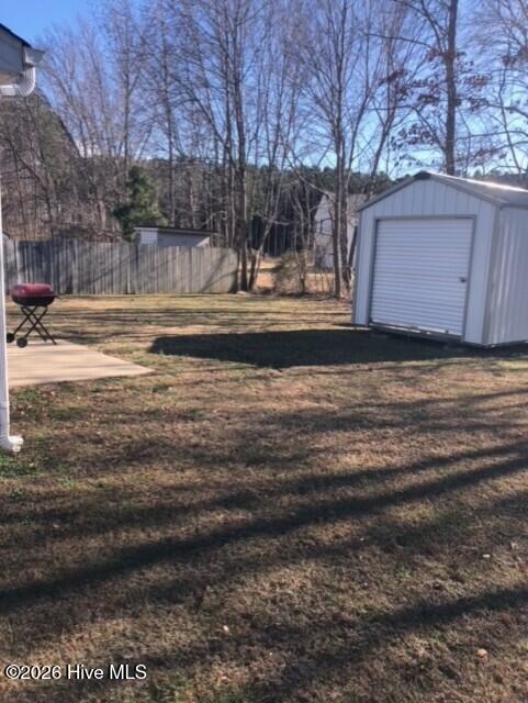 3923 Sabre Lane Wilson, NC 27896 - Photo 5 of 18 BACK YARD WITH STORAGE BUILDING