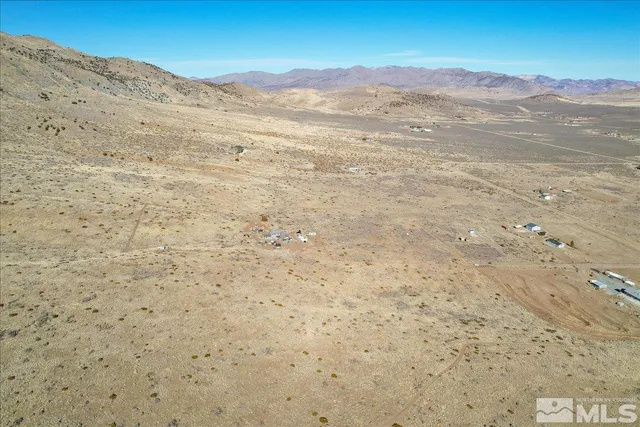 a view of mountain with an ocean
