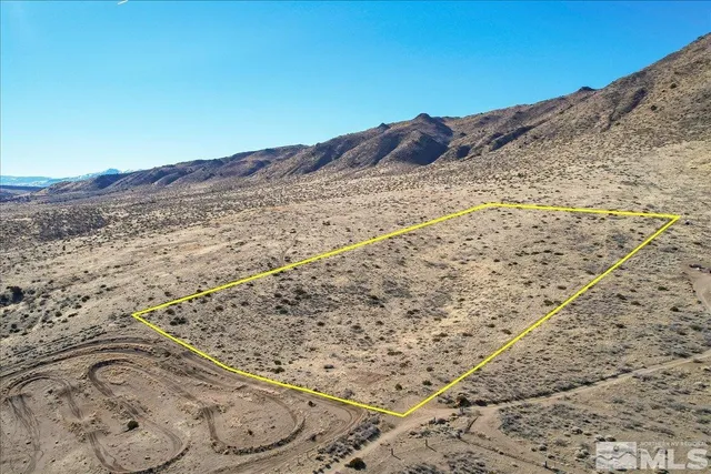 a view of mountain with a beach