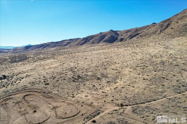 a view of a dry space with mountain view