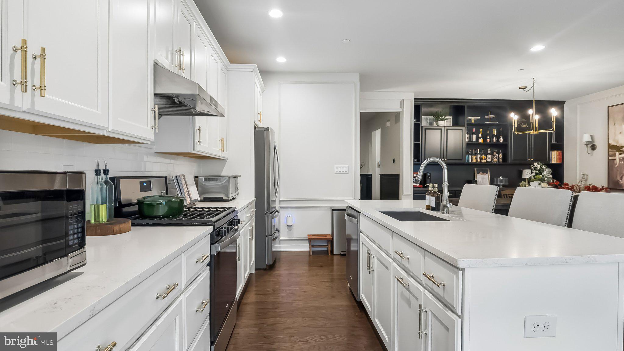 257 Junction Road Media, PA 19063 - Photo 9 of 25 a kitchen with a sink stove and cabinets