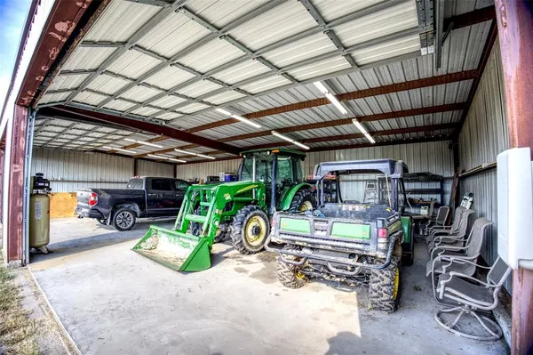 a view of a garage with a bike and car