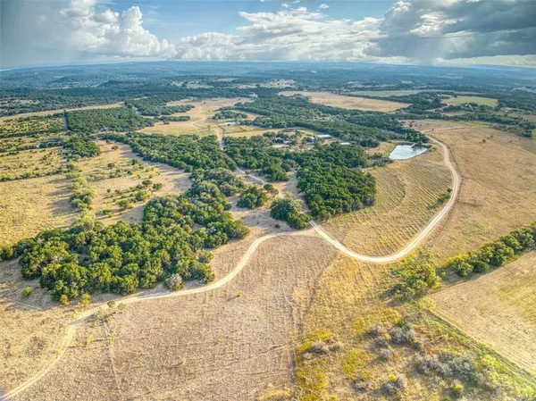 a view of a swimming pool with a yard