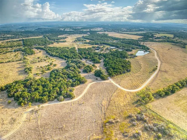 a view of a swimming pool with a yard