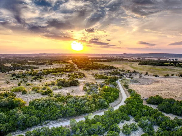 an aerial view of residential building and lake
